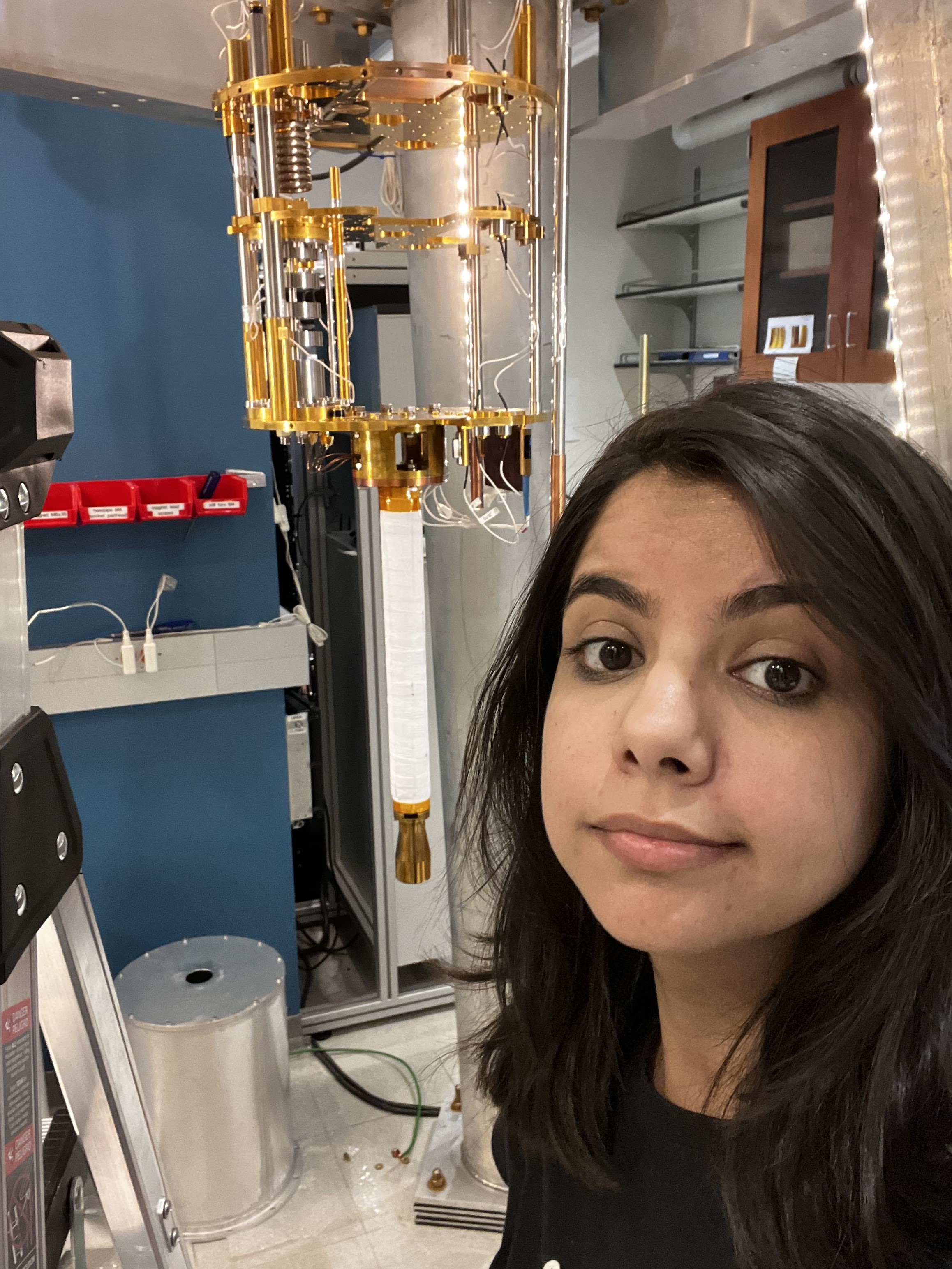 Yashika Kapoor in the lab with a dilution fridge