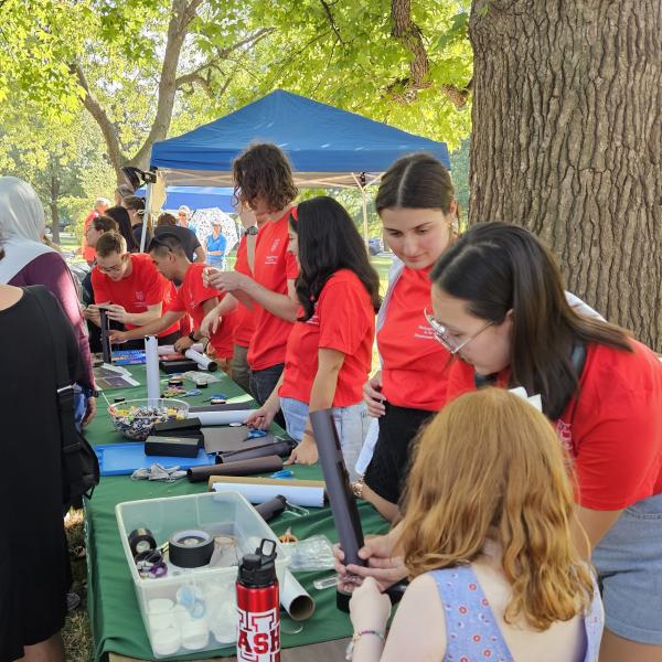 Physics department students manning a table at the Annual Astronomy Festival at Tower Grove Park (Sep 30, 2023)