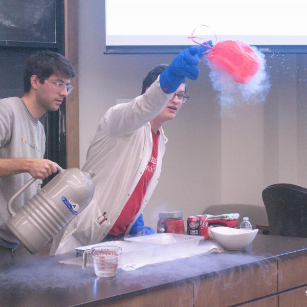 Grad students use liquid Nitrogen to demonstrate how gasses contract when exposed to extreme cold