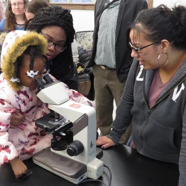 Students look at tardigrades