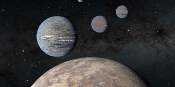 An artist’s rendering of five planets orbiting TOI-1233, four of which were discovered using the Transiting Exoplanet Satellite Survey (TESS), an MIT-led NASA mission.