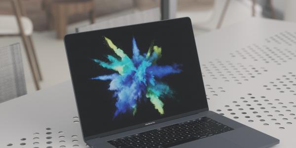 open macbook pro with colorburst screensaver