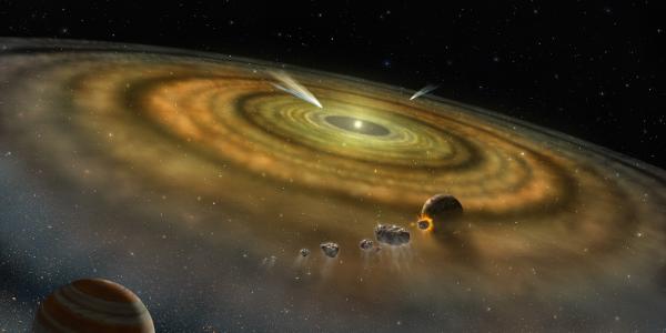 Artist's conception of the dust and gas surrounding a newly formed planetary system. Image Credit: NASA