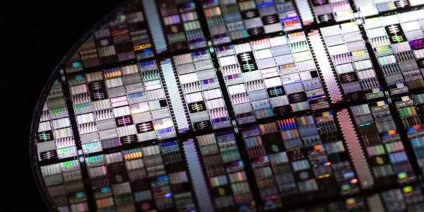 This superconducting qubit wafer was fabricated through the Superconducting Qubits at Lincoln Laboratory (SQUILL) Foundry, which is expanding access to quantum research by fabricating quantum circuits for U.S. research organizations. Photo: Nicole Fandel