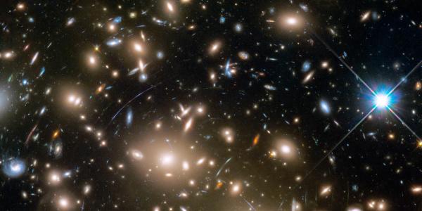 This Hubble Space Telescope mosaic shows a portion of the immense Coma galaxy cluster. This Hubble Space Telescope mosaic shows a portion of the immense Coma galaxy cluster — containing more than 1,000 galaxies — located 300 million light-years away. The 