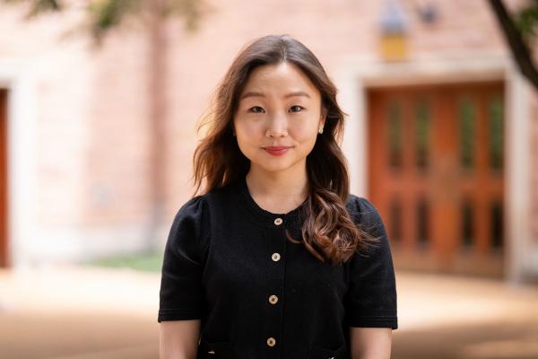 Sohee Chun in front of a building on the Danforth Campus