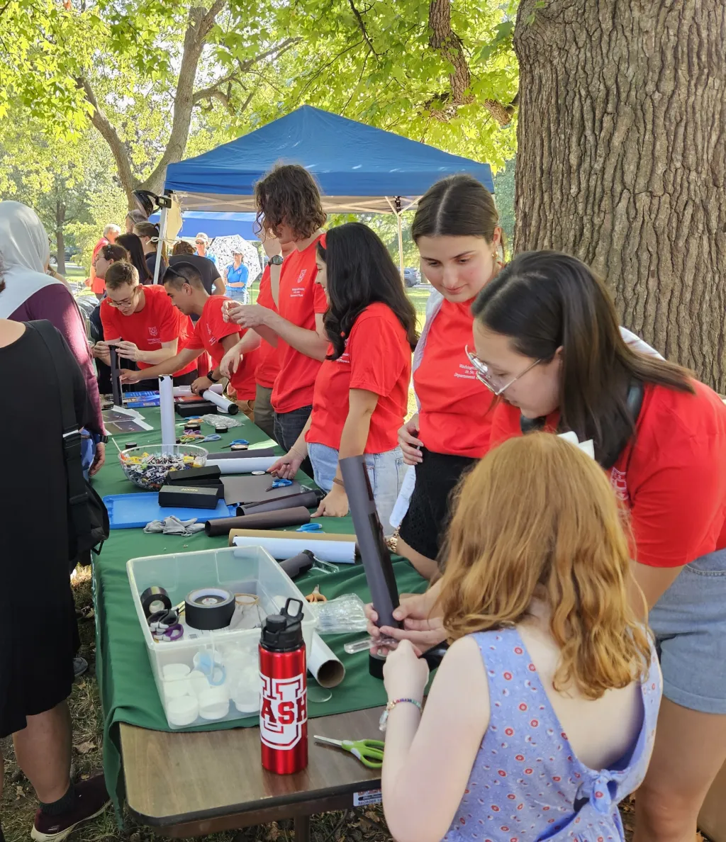 Physics department students manning a table at the Annual Astronomy Festival at Tower Grove Park (Sep 30, 2023)
