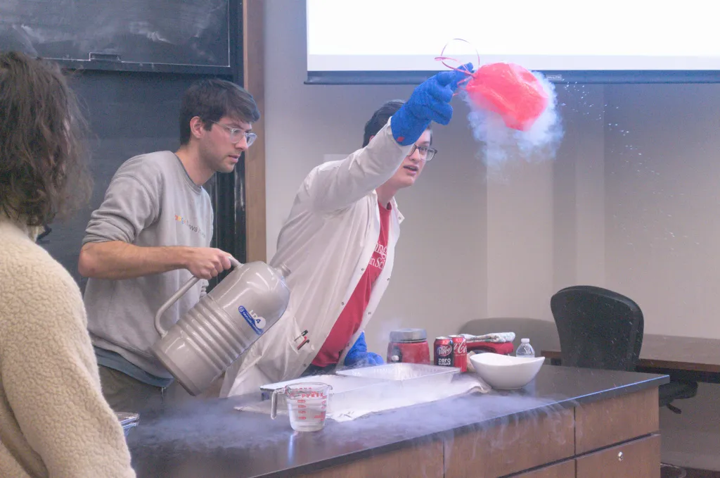 Grad students use liquid Nitrogen to demonstrate how gasses contract when exposed to extreme cold