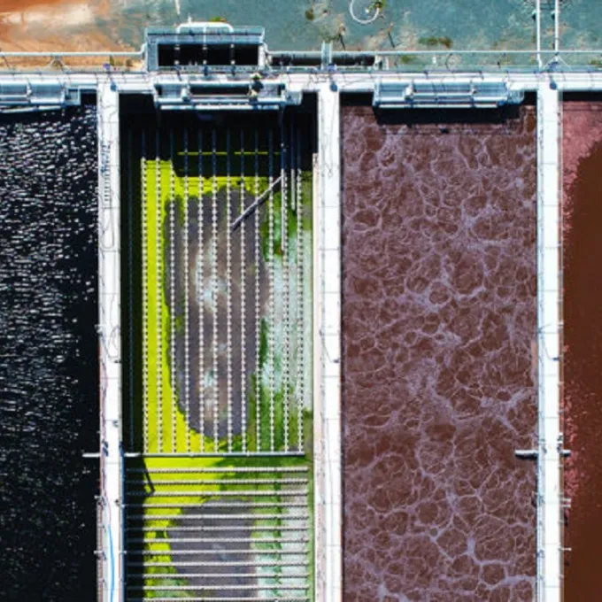 Drone footage shows the color variation of many different microbial systems at work within a wastewater treatment plant aeration pond system. (Image: Shutterstock)