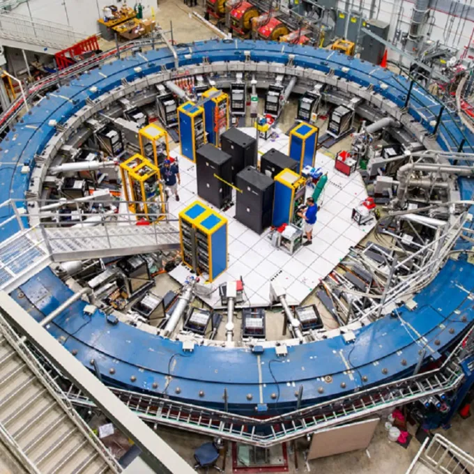 The Muon g–2 experiment (shown) studies how muons wobble in a giant, doughnut-shaped magnet. The results disagree with the standard model of particle physics, hinting at the possible existence of new particles.